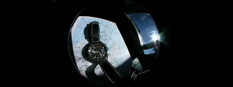 A T.O.T TIME ON TARGET timepiece over a map