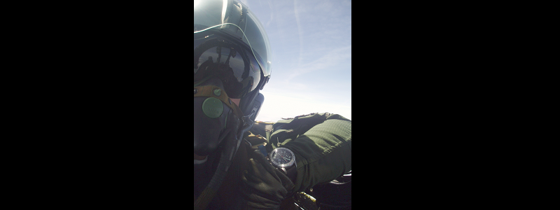 Pilot in cockpit showing off his T.O.T TIME ON TARGET